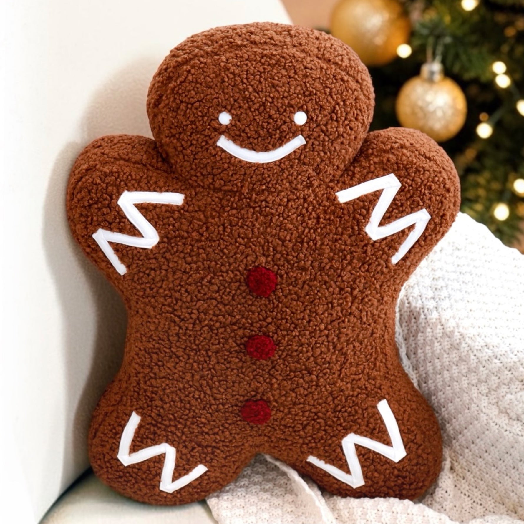 Plush sherpa gingerbread pillow measures 18"x14"