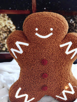 Plush sherpa gingerbread pillow measures 18"x14"