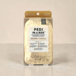 Pedi in a Box Golden Vanilla pedicure kit  on a beige background
