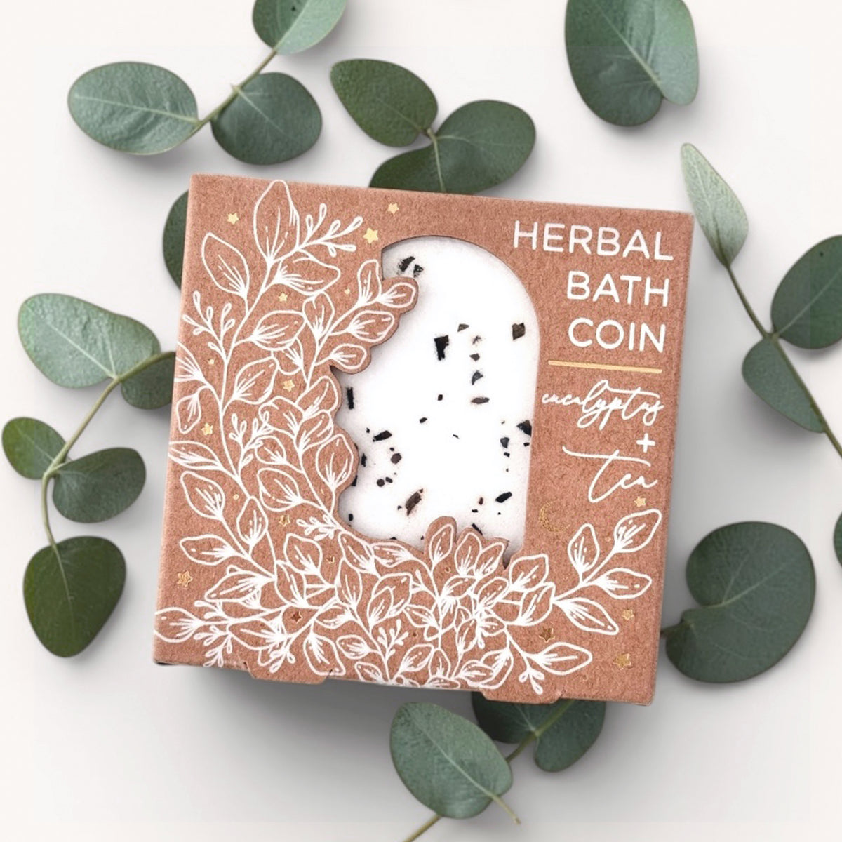 Herbal bath coin eucalyptus and tea scent on a white background with leaves