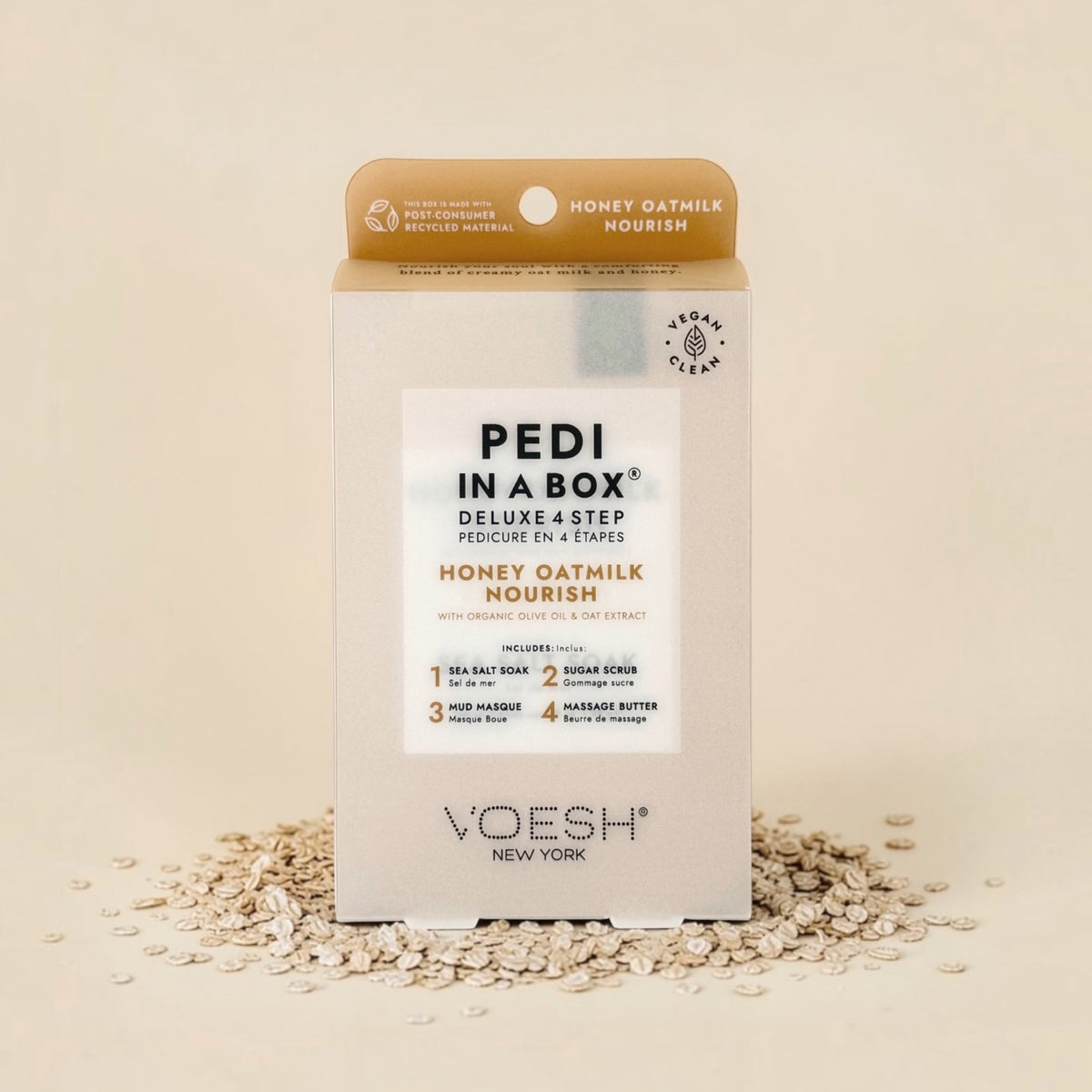 VOESH Pedi in a Box Honey Oatmilk Nourish kit on a beige background with oats.