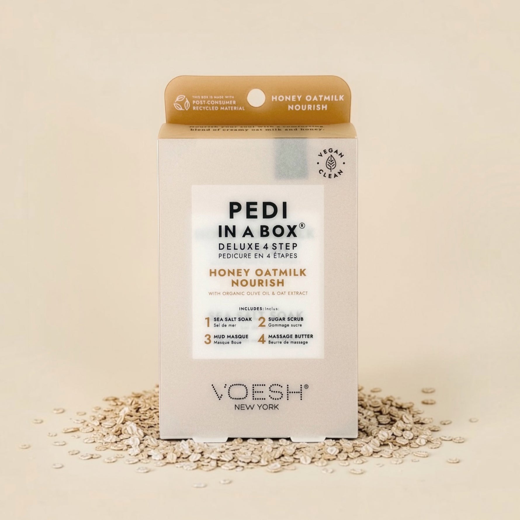 VOESH Pedi in a Box Honey Oatmilk Nourish kit on a beige background with oats.