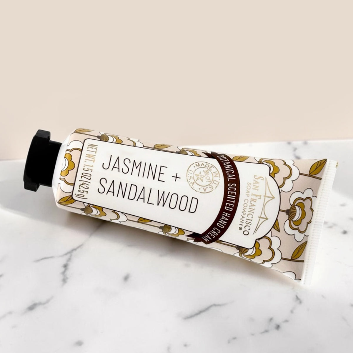 Jasmine + Sandalwood hand cream on a marble surface