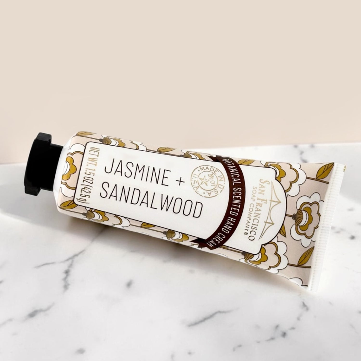 Jasmine + Sandalwood hand cream on a marble surface