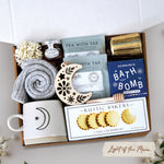 Light of the Moon mug box comes with moon and sun ceramic mug, cozy boot socks, mini honey and dipper, 2 tea bags, moon wood nordic ornament, old whaling co mariners moon bath bomb, votive and tea light 
