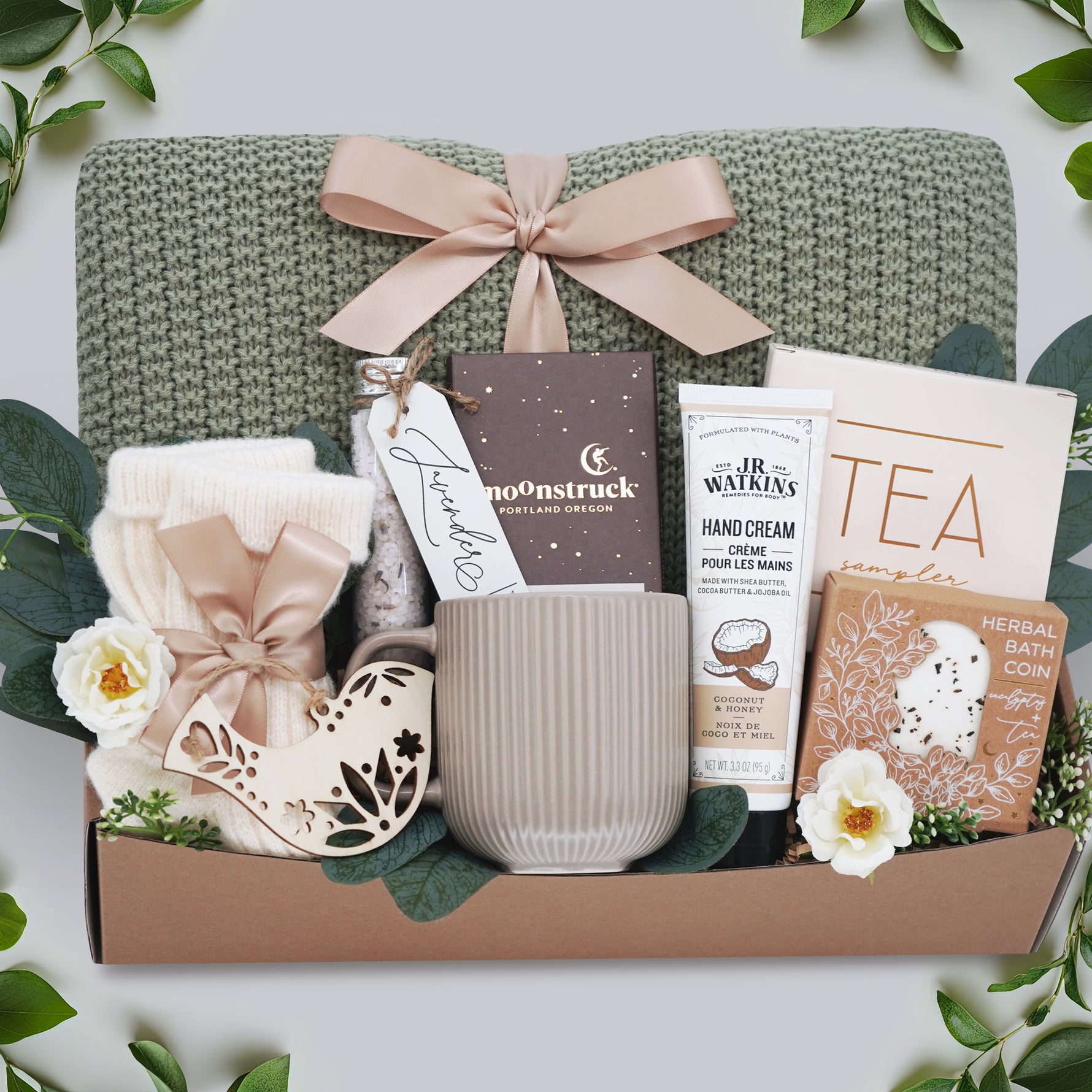 In the Garden blanket gift box by Wildflower Pop with sage knit blanket and spa items