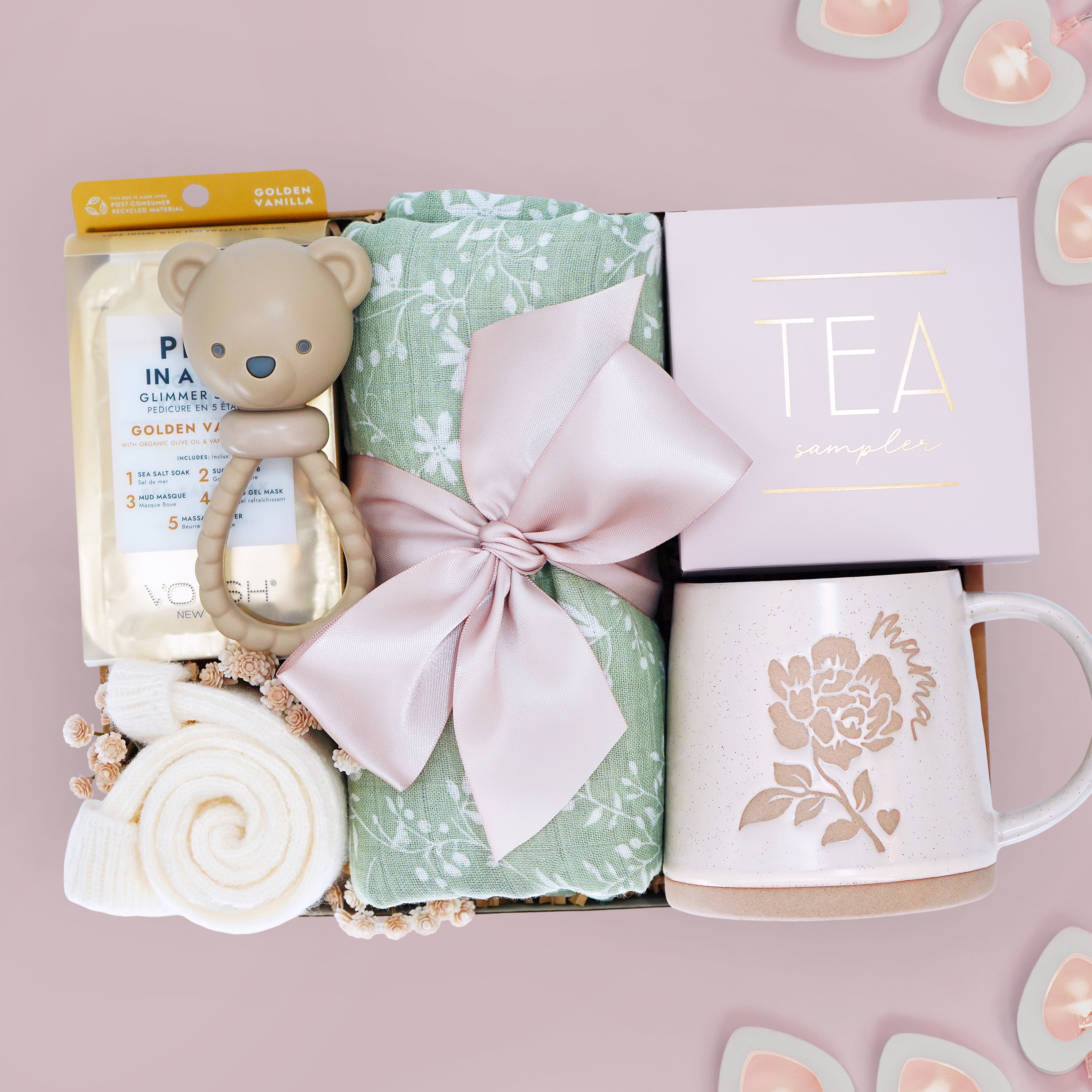 Wildflower Pop Gift set with teddy bear rattle, tea, and mug on a pink background