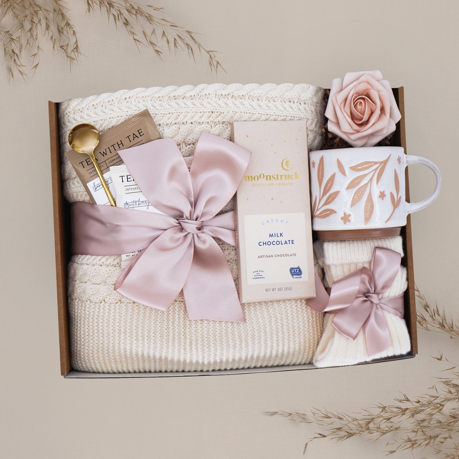 Wildflower Pop Cherry Blossom Gift box with tea, chocolate, mug, and decorative elements on a neutral background