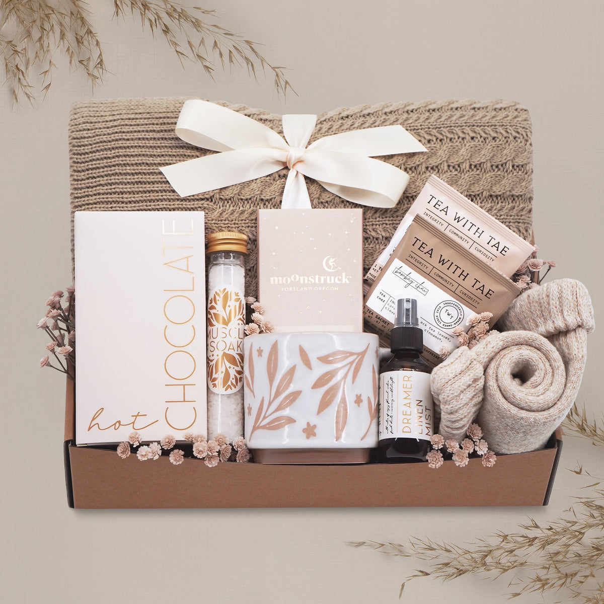 Cozy Comfort blanket gift box by Wildflower Pop with cable knit blanket, mug, cocoa, socks, linen mist, tea and chocolate