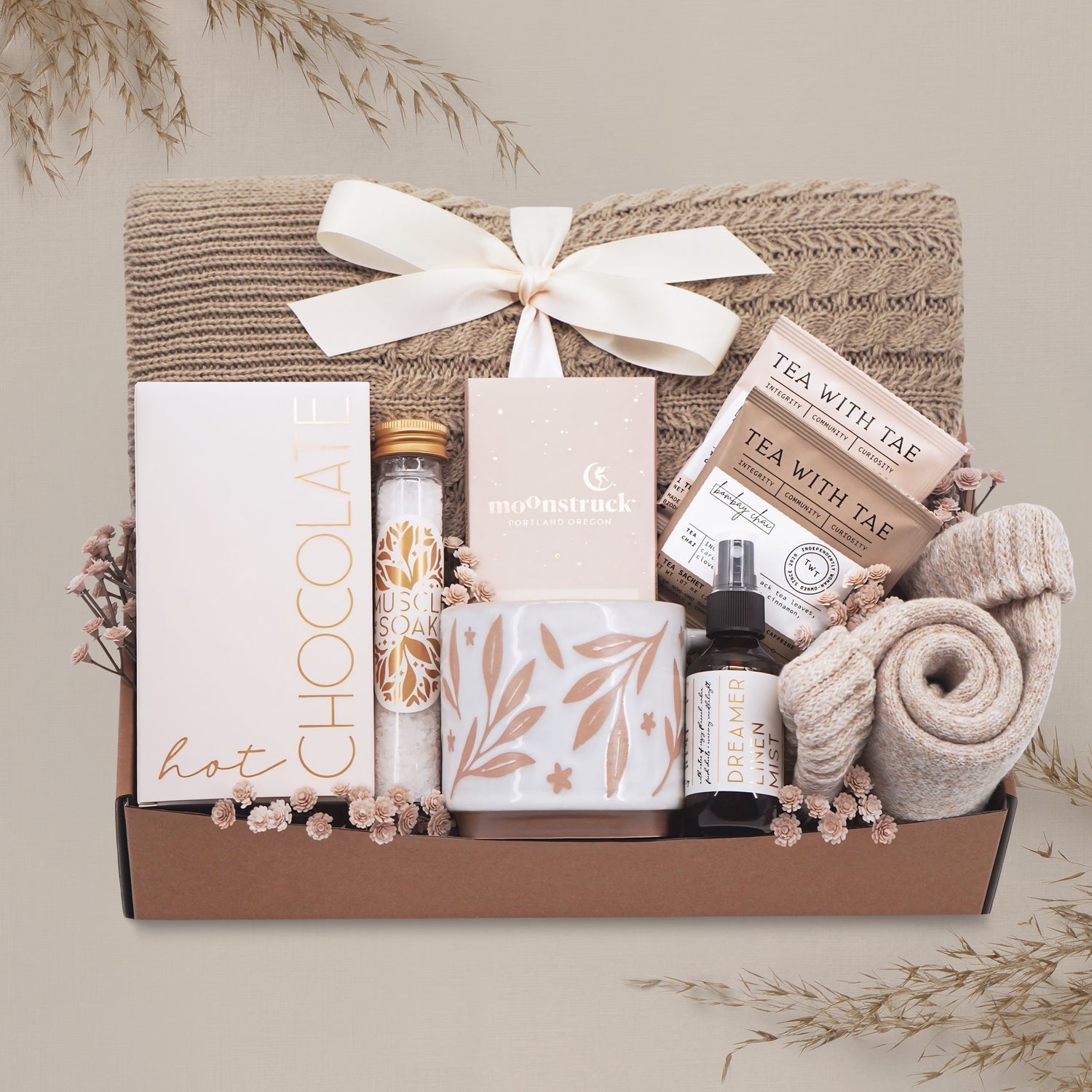 Cozy Comfort blanket gift box by Wildflower Pop with cable knit blanket, mug, cocoa, socks, linen mist, tea and chocolate