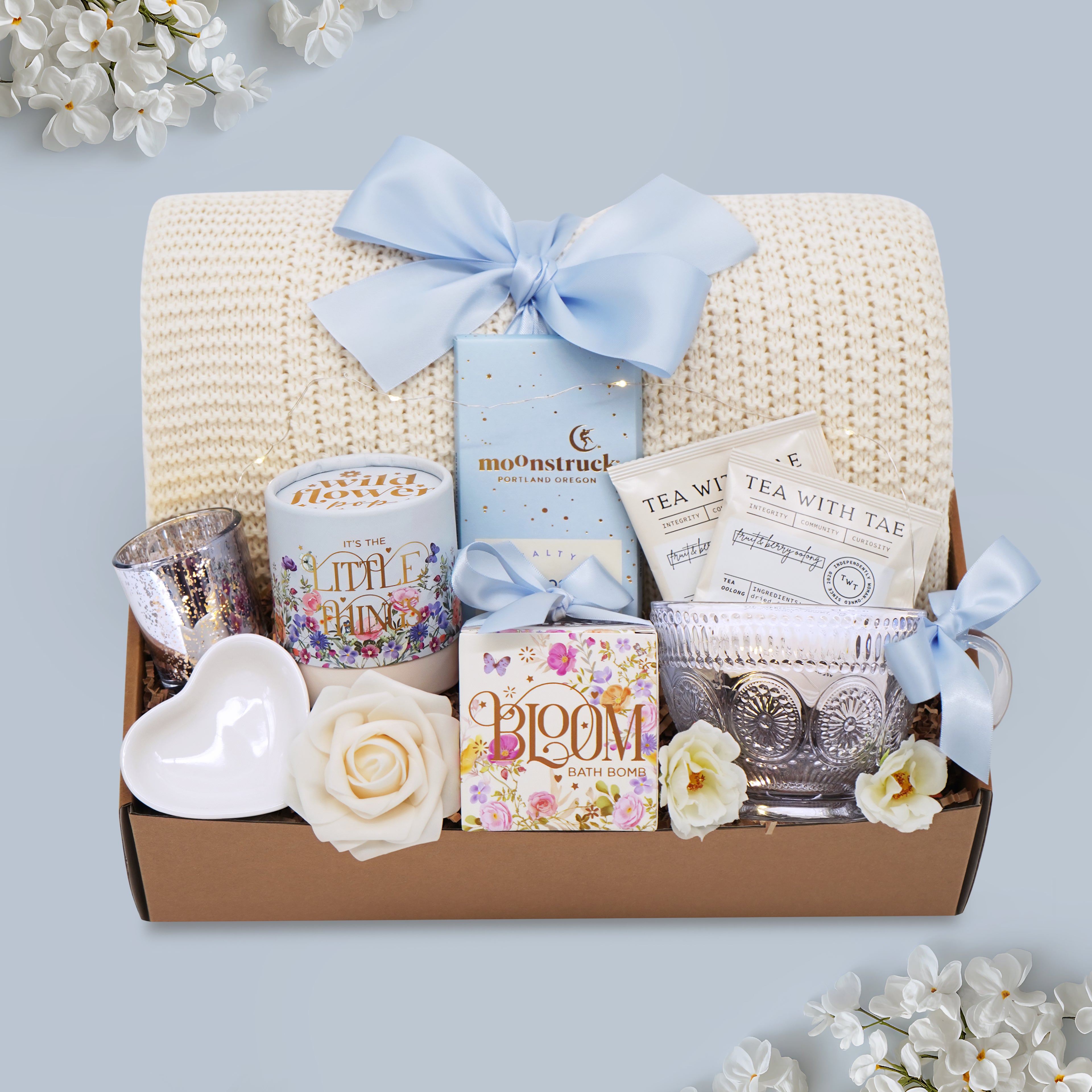 Crystal Palace Tea gift box with cream knit blanket, vintage sunflower glass mug, and curated self-care treats