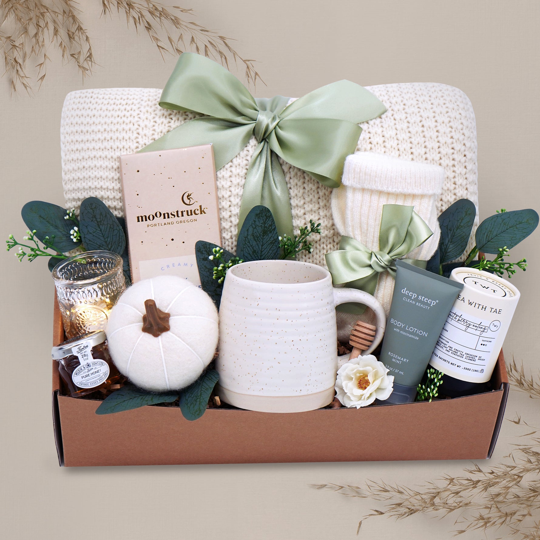 Farmers Market blanket gift box with a mug, candle, and other items on a gray background