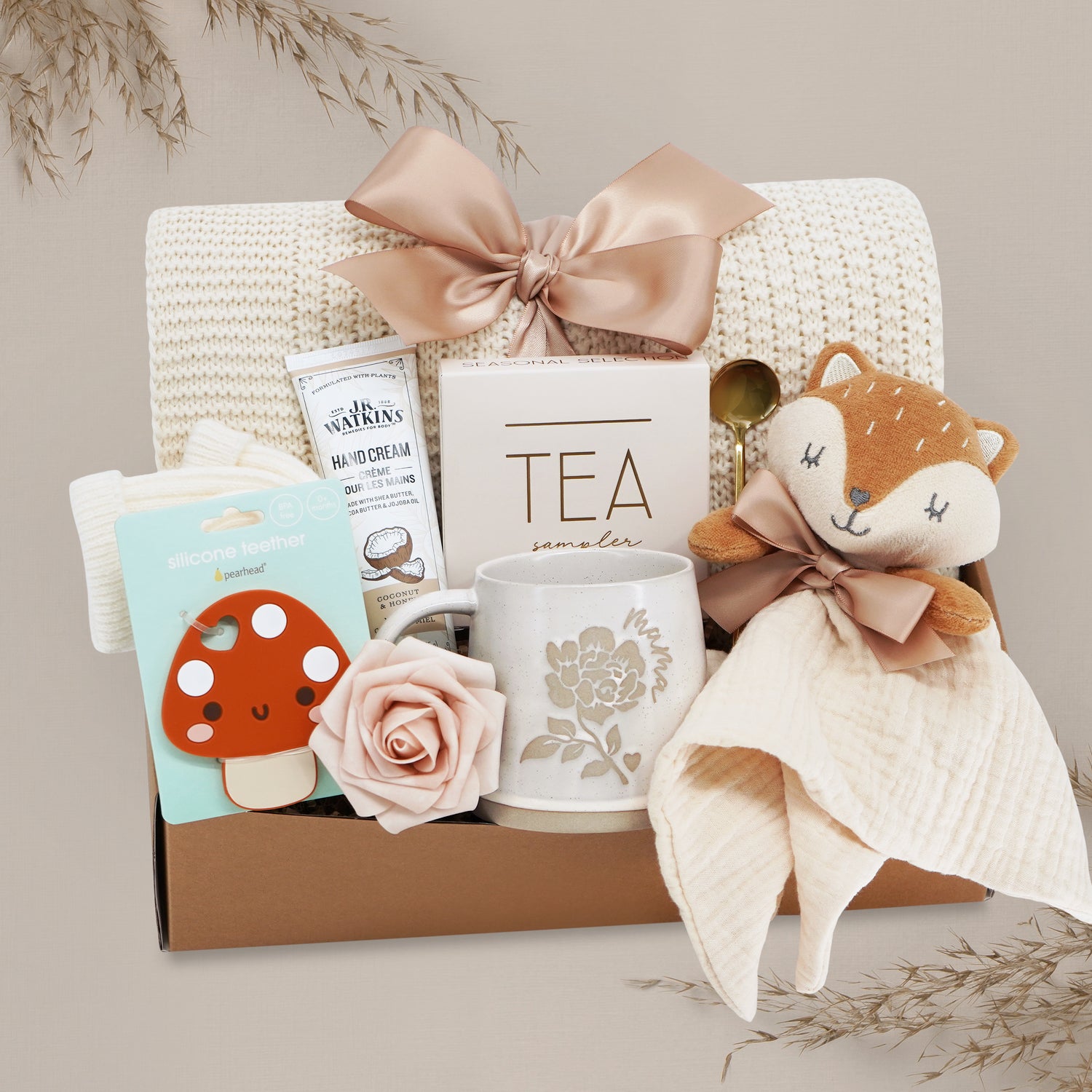 Forest Friends new mama gift box by Wildflower Pop comes with a cream lace knit blanket, tea sampler, fox snuggle blanket, choice of mug, hand cream, mushroom silicone teether, cream knit socks, gold demitasse spoon 
