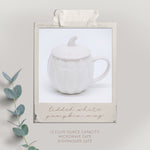 White ceramic mug with lid on a light gray background