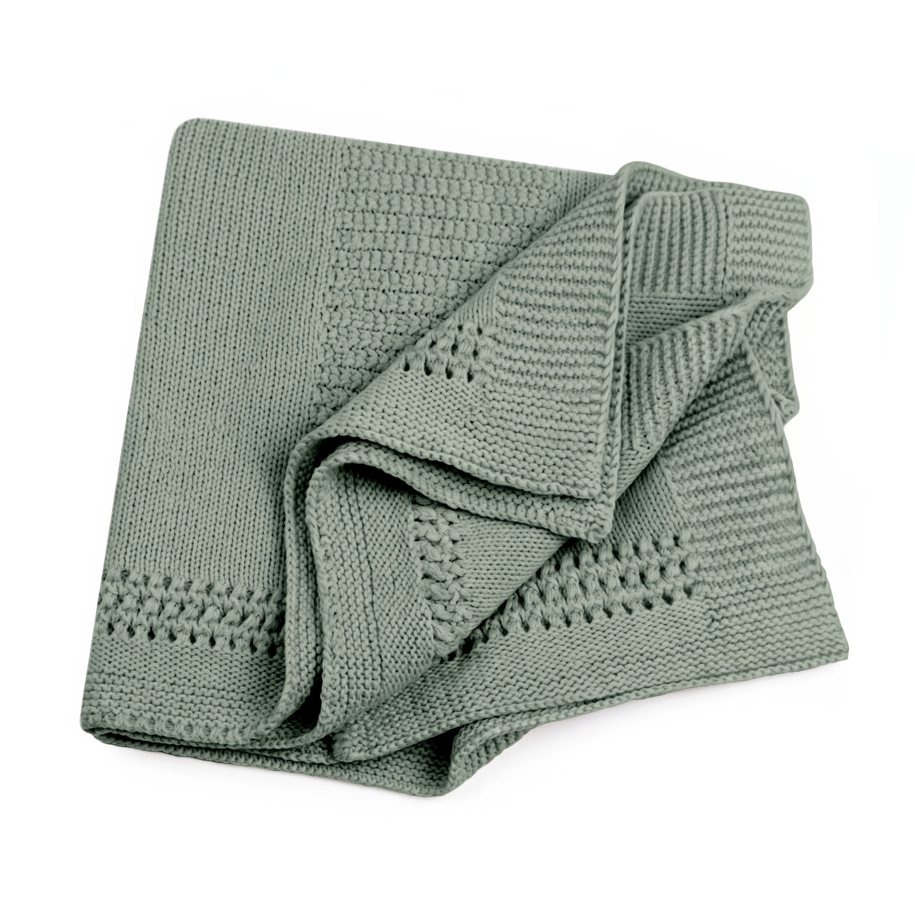A folded dusty sage-colored lace knit blanket with textured patterns, shown on a solid white background.