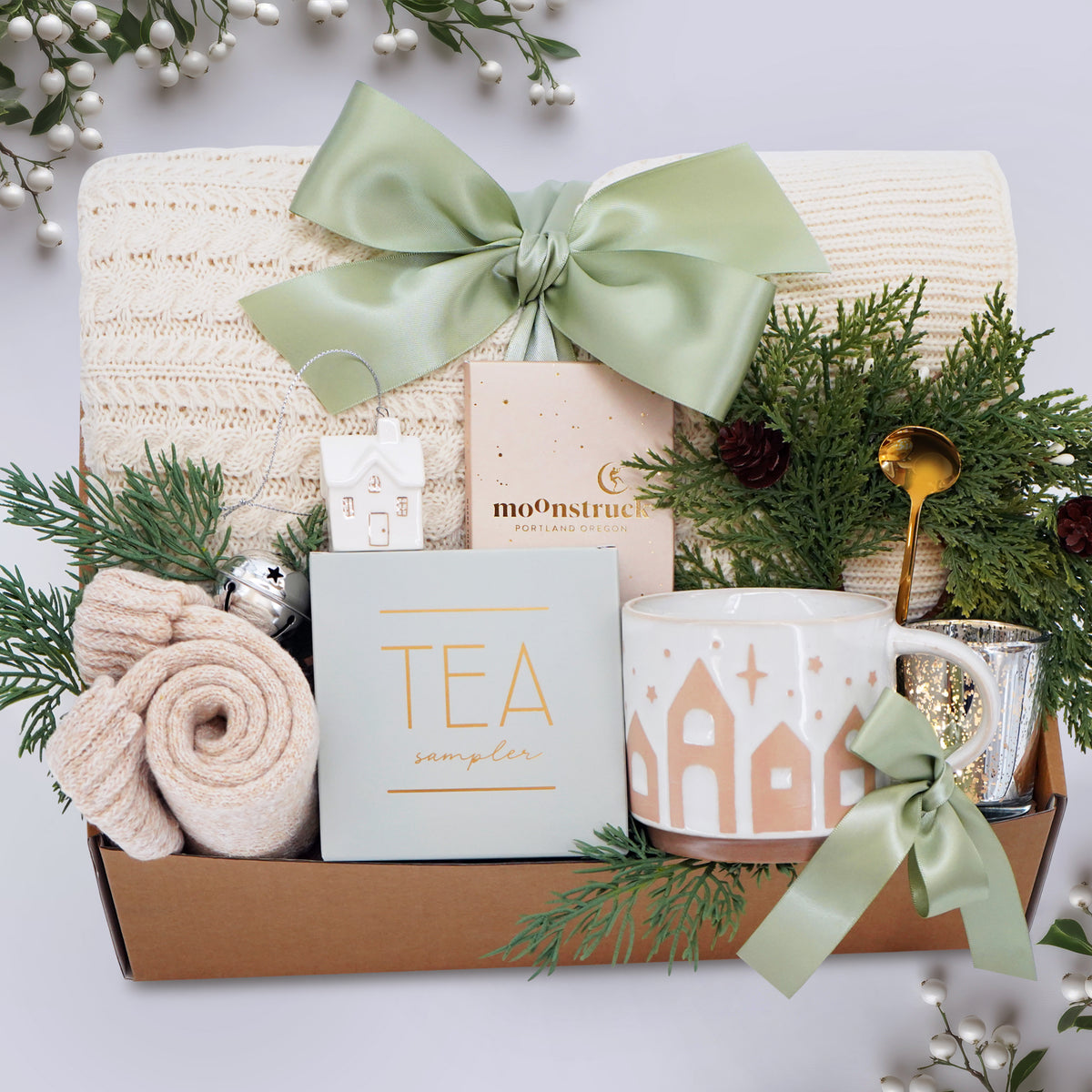 Wildflower Pop Holiday Gift basket with tea, mug, and decorative items on a light background