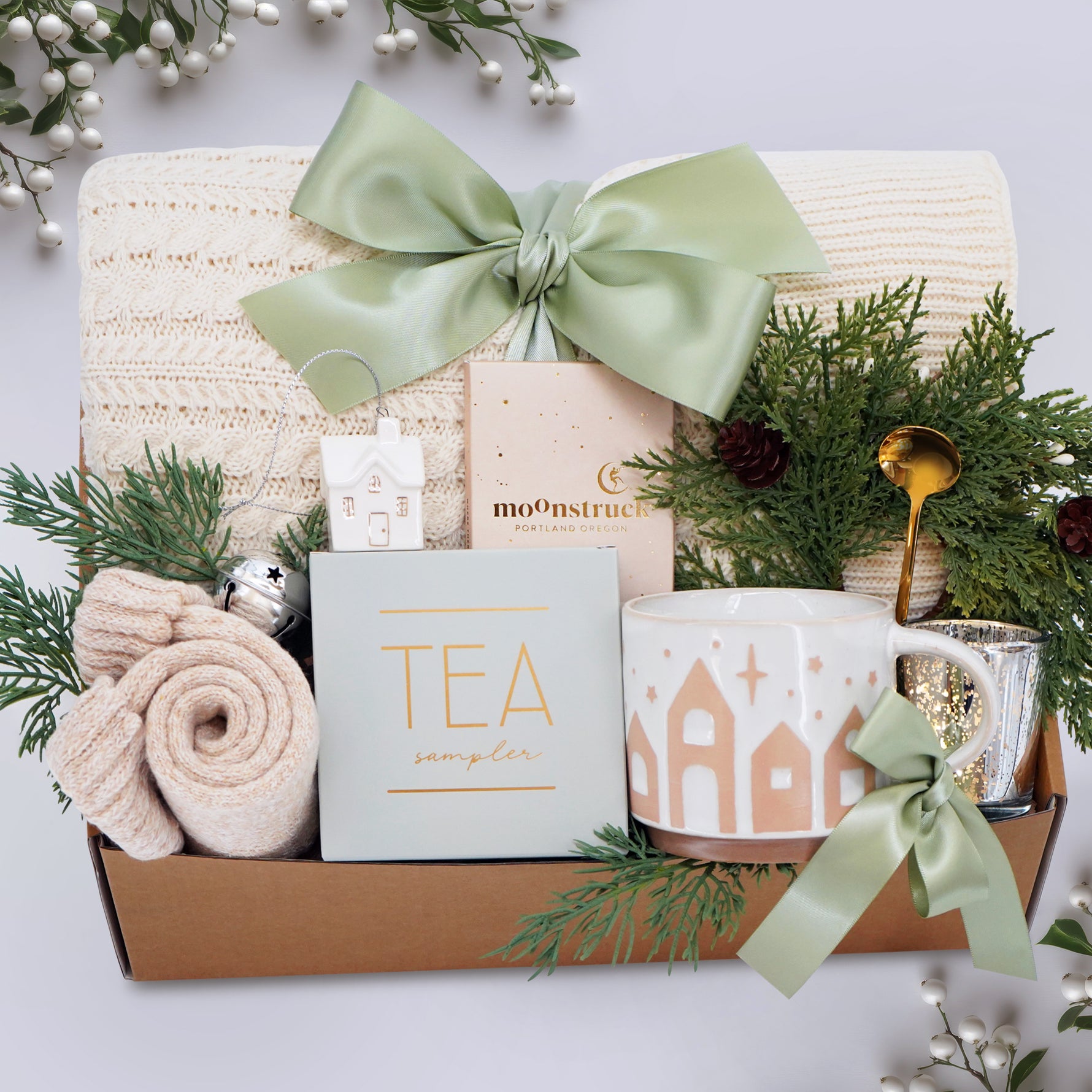 Wildflower Pop Holiday Gift basket with tea, mug, and decorative items on a light background