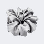A single jumbo satin hair scrunchie in Silver Moon grey centered on a light gray background.