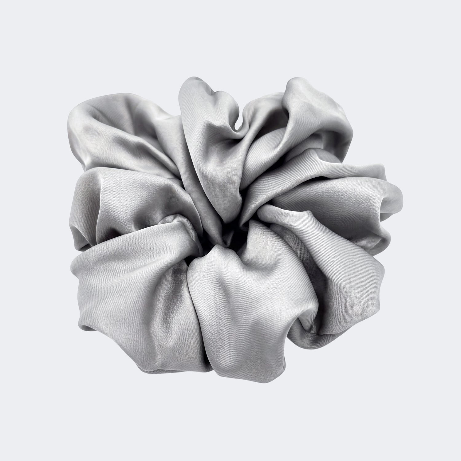 A single jumbo satin hair scrunchie in Silver Moon grey centered on a light gray background.