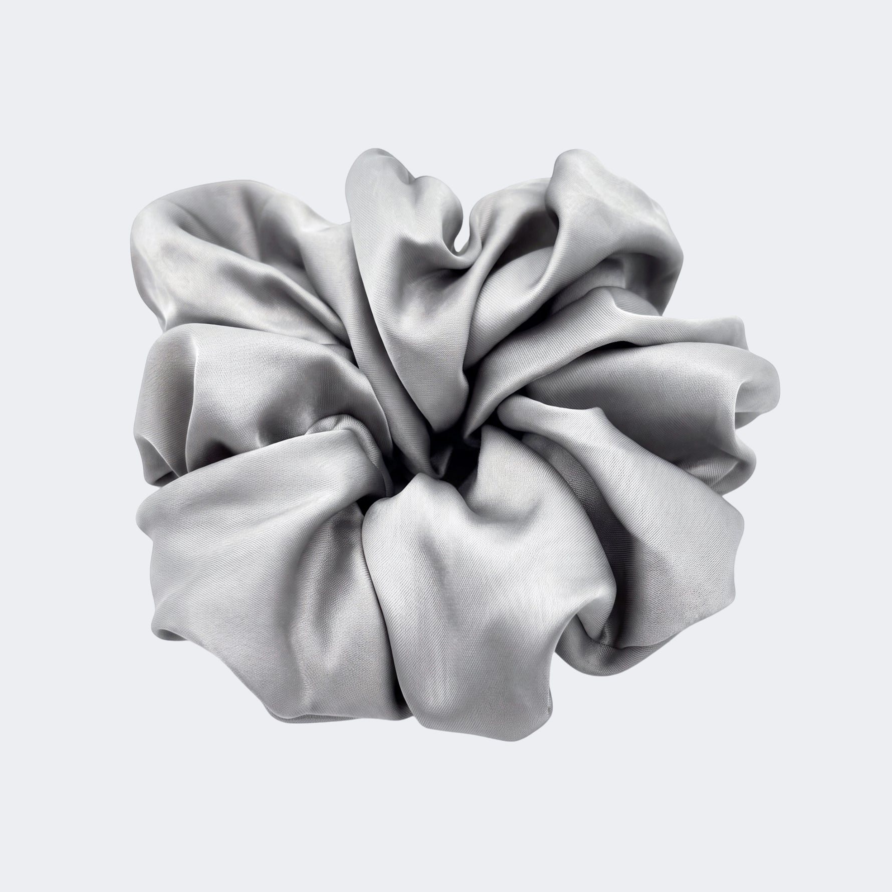 A single jumbo satin hair scrunchie in Silver Moon grey centered on a light gray background.