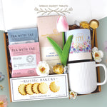 Spring sweet treats mug box come with a ribbed white ceramic mug, it's the little things tube with lindt truffles, gold demitasse spoon, full size milk chocolate moonstruck bar, 2 tea with tae tea bags, and rustic bakery vanilla shortbread cookies 