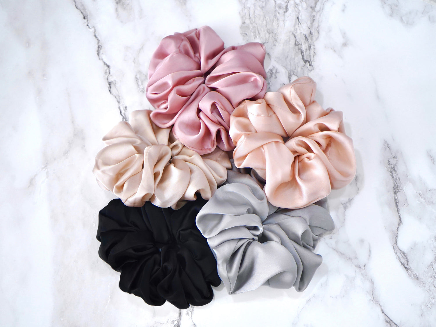 This listing is for ONE jumbo silky scrunchie. Premium fabric and gorgeous colors! These scrunchies measure about 5" across.

Fabric color options are as follows: - Tea Rose (mauvy-pink) - Blushing (pale blush pink) - Milk Tea (warm grey-pinky-beige) - Silver Moon (icy grey) - Midnight (classic black)