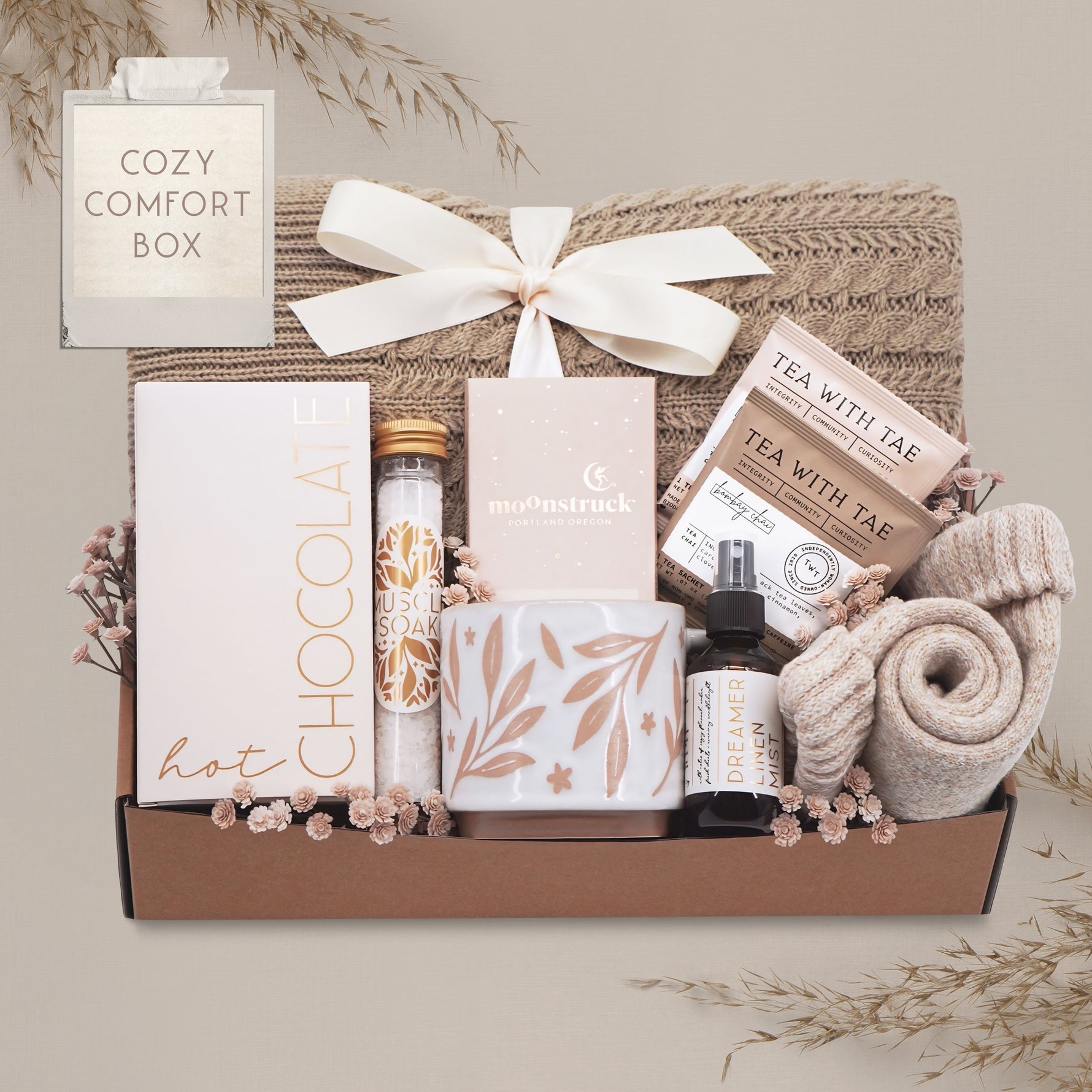 Cozy Comfort blanket gift box by Wildflower Pop with cable knit blanket, mug, cocoa, socks, linen mist, tea and chocolate