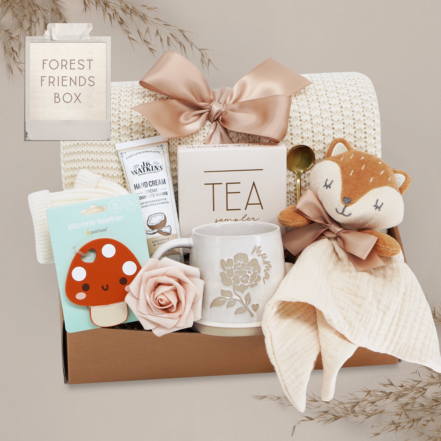 Forest Friends new mama gift box by Wildflower Pop comes with a cream lace knit blanket, tea sampler, fox snuggle blanket, choice of mug, hand cream, mushroom silicone teether, cream knit socks, gold demitasse spoon 