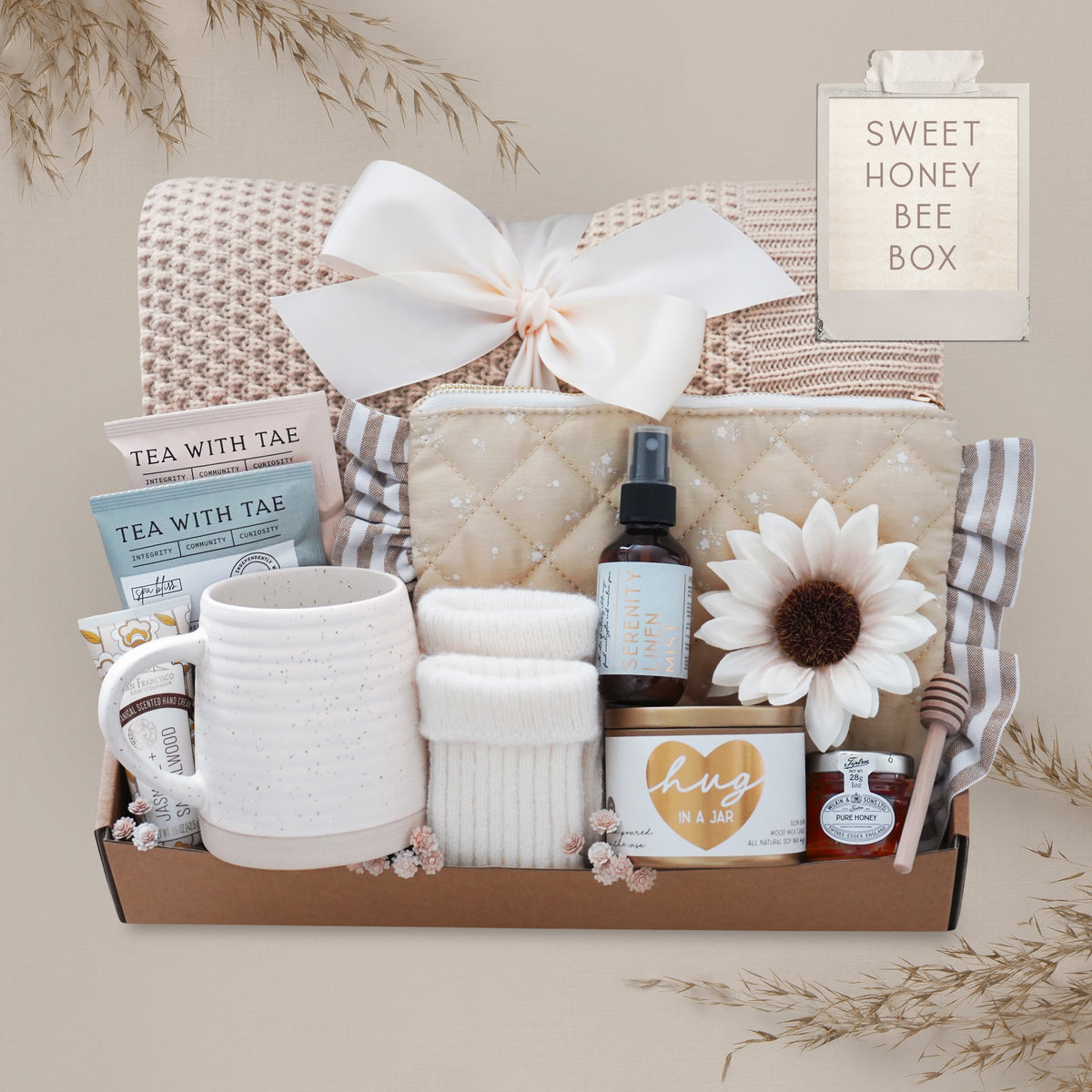 Wildflower Pop Luxury blanket gift box with cozy knit throw, candle, tea, mug, and pampering essentials in neutral tones