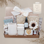 Sweet Honeybee luxury gift box featuring honeycomb knit blanket, candle, tea, mug, honey jar, socks, and self-care essentials