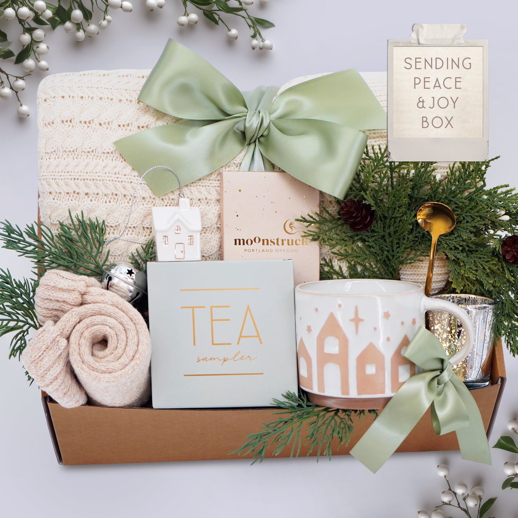 Wildflower Pop Holiday Gift basket with tea, mug, and decorative items on a light background