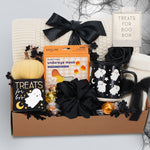 Wildflower Pop Halloween-themed boo basket with an exclusive ghost mug, candy, and decorative items on a white background.